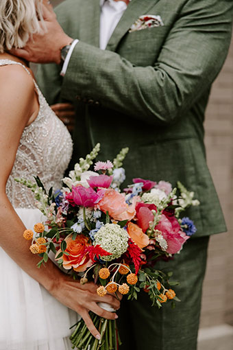 bride and groom with bouquet close-up