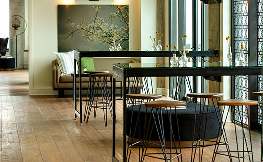 hotel lobby with couch and high tables